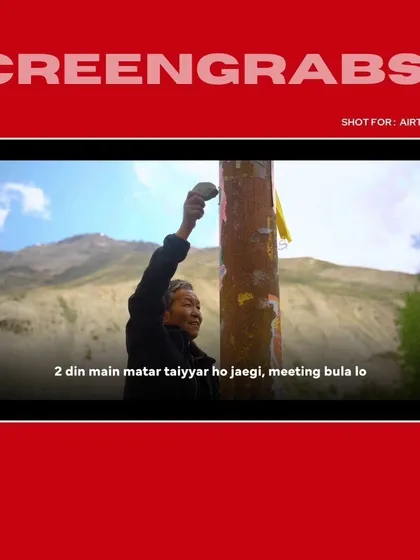 A screengrab from the Airtel "Connecting the Odds" series. This shot captures a key moment of storytelling against the stunning backdrop of the Himalayas.