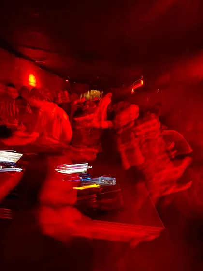 A motion-blurred shot capturing the chaotic, high-energy vibe of my set at Ferro Bar in Porto, Portugal. The red lights and movement perfectly represent the wild night.