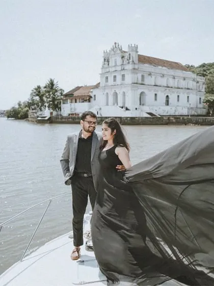 For adventurous couples, a destination shoot is the perfect way to tell your story. This dramatic shot from a pre-wedding session on a yacht in Goa shows how we can create high-fashion, editorial-style images that are both bold and romantic.