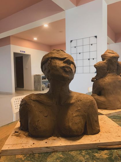 A student's work from our sculpture workshop, capturing a moment of quiet contemplation. The blindfolded figure, with its head tilted upwards, evokes a powerful sense of inner searching and trust.