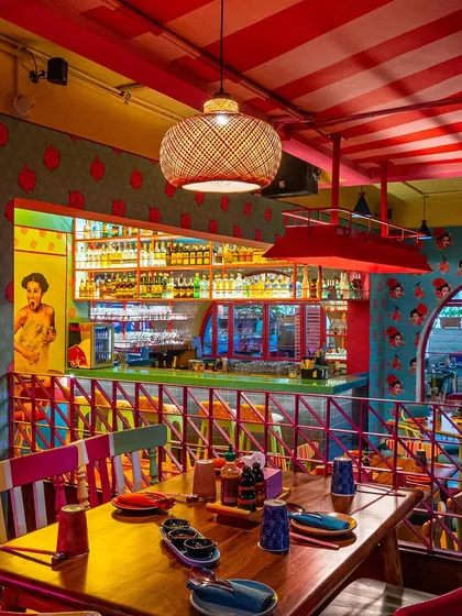 For The Fatty Bao, the goal was to capture its vibrant, high-energy personality. This shot highlights the eclectic mix of colors, from the red-striped ceiling to the pop-art graphics and the brightly lit bar, showing how I capture the unique character of a brand.