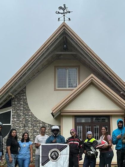 The group posing in front of our homestay in Sakleshpura. Our weekend trips are a perfect getaway.