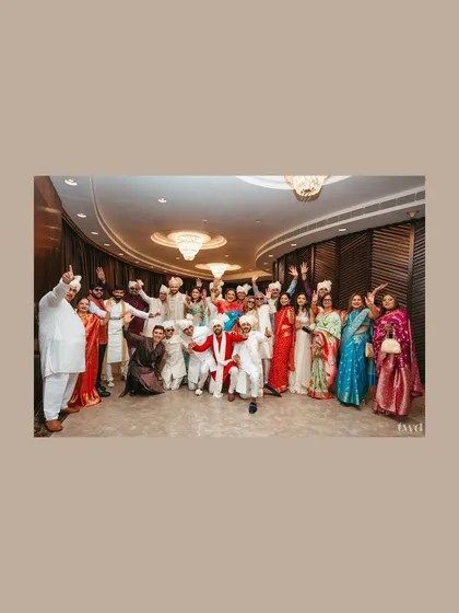 The whole baraat squad! A wide-angle shot of the entire group posing together, a fantastic memory of the groom's energetic procession.
