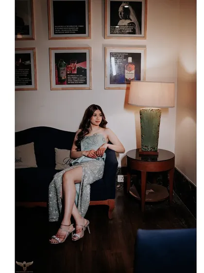 A stylish solo portrait of the bride-to-be at her cocktail party. The elegant pose and chic setting highlight her personality and the sophisticated vibe of the event.