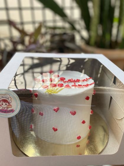 Our "Welcome Home" cake, boxed and ready to create a special moment.