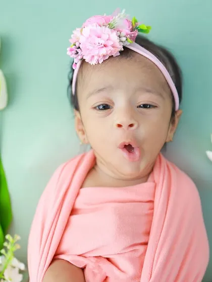 Look at this little expression queen. While sleeping poses are beautiful, I also adore capturing these awake moments filled with personality. This little 'o' of surprise is a perfect example of the candid, fleeting expressions I watch for.