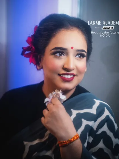 A beautiful retro-inspired look. The classic winged liner, red lip, and soft hairstyle are hallmarks of vintage glamour that we teach in our courses.