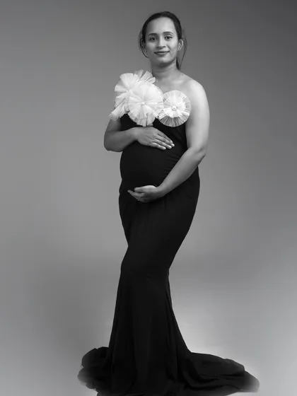 A full-length black and white shot of the Veneccia gown. The mermaid-style fit is elegant and flattering.