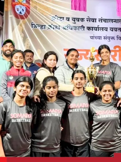 Victory for our K J Somaiya College of Science and Commerce Junior Girls' Basketball Team. The team proudly poses with their coaches and the championship trophy after winning the DSO State Basketball Tournament.