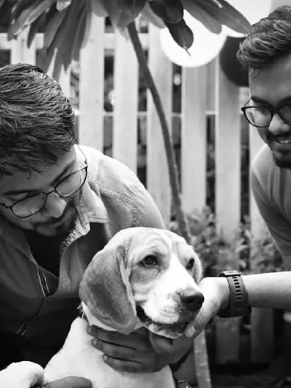 A beautiful black and white shot capturing the bond between two friends and a gentle beagle.