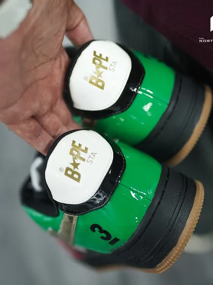 The heel tabs of the Bapesta Dubai edition, featuring the BAPE STA logo in gold foil.