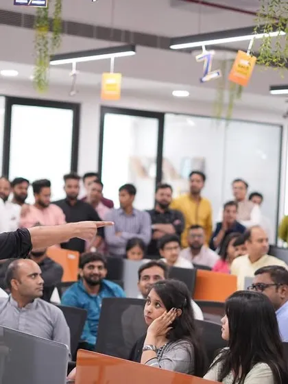 Commanding the room at the Investoxperts anniversary celebration. Performing in an open office environment creates a unique, high-energy vibe.