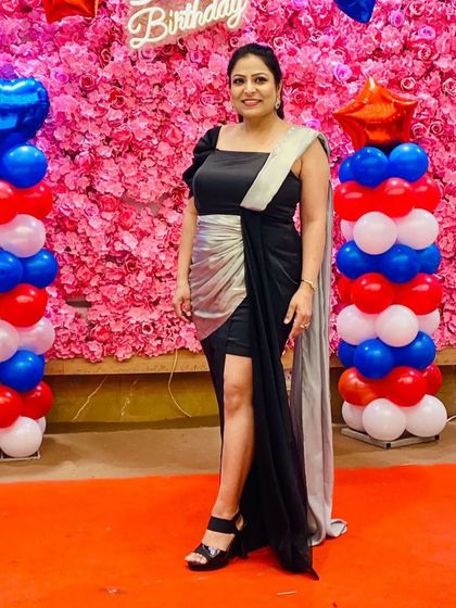 Another shot of my client shining in her custom black and silver gown. The thigh-high slit adds a touch of modern glamour to the elegant design.