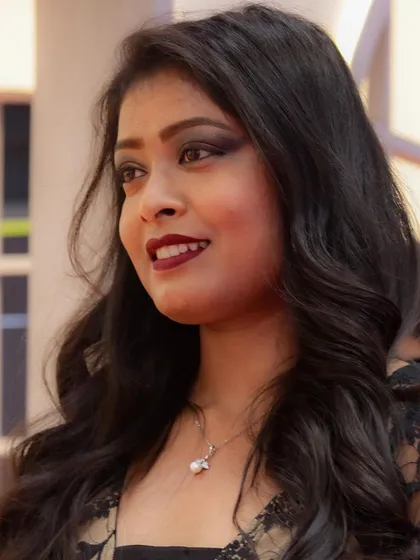 This image captures the polished finish of a professional makeup application, suitable for high-profile events.