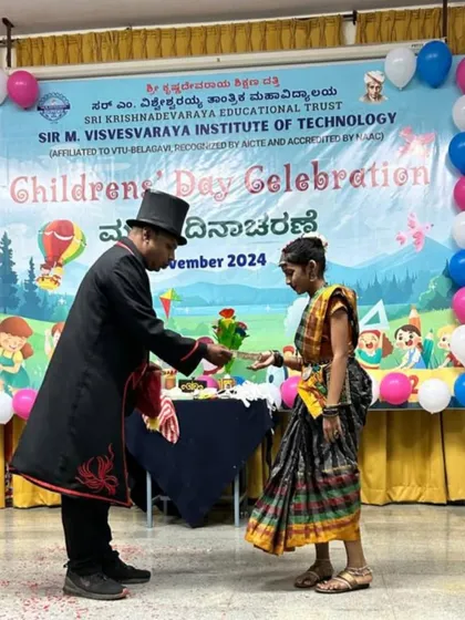 A young volunteer from the audience helps me with a flower trick during a Children's Day celebration. I love making kids a part of the magic.