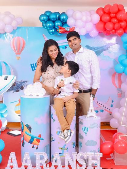 A thrilling 'Avengers' themed birthday party, with superhero cutouts, a cityscape backdrop, and dynamic balloon arrangements, ready for action.