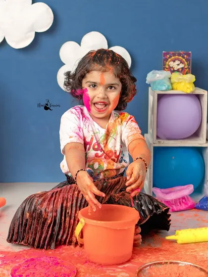 Lost in the fun of playing with colors. These candid moments of pure, messy joy are what make Holi sessions so special.