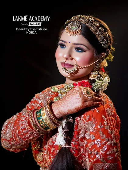 A contemporary bridal look with a focus on sharp, defined features. Our students learn to create this modern aesthetic, complete with bold eyes, intricate henna, and perfectly placed jewelry.