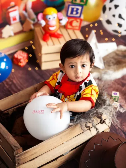 Our little Woody peeking out of a rustic wooden crate. The Toy Story theme is full of colour and nostalgia.