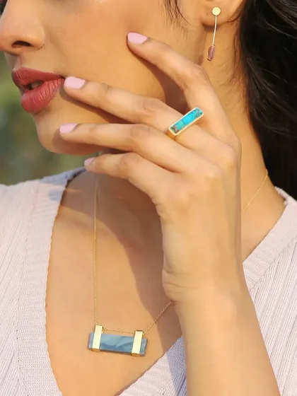 Details matter in fashion photography. This close-up on a model wearing gemstone jewelry shows my ability to shoot for accessory brands, focusing on the product's color, texture, and how it complements the wearer's style.