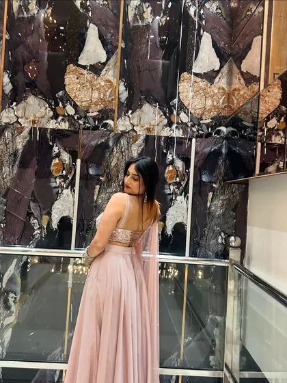 A back view of the pink lehenga, showing off the blouse design. I make sure to capture the outfit from all angles.