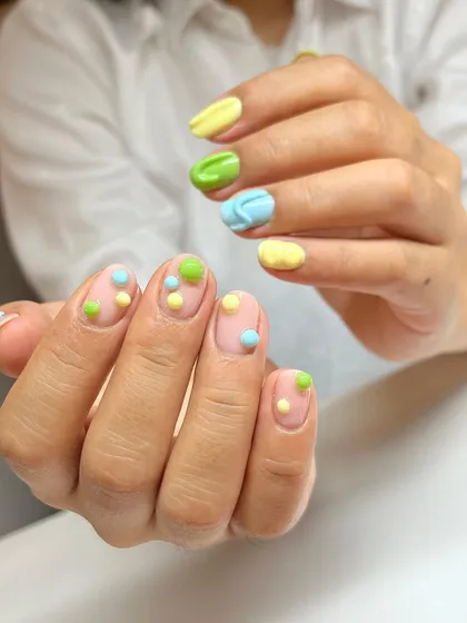 A different view of our pastel candy 3D nail art, showing how the design works across both hands for a fun, mismatched look.
