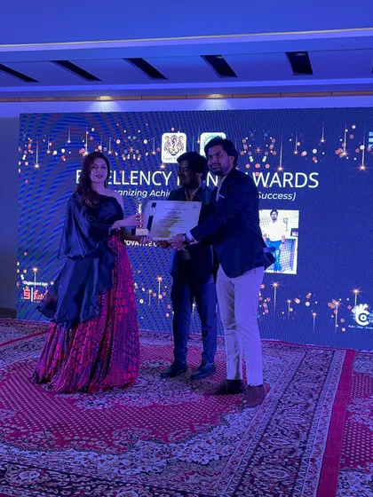 On stage during the award ceremony, a moment of recognition for our team's collective effort.