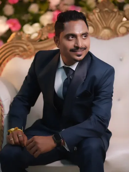 A candid shot of the groom, looking relaxed and happy during the wedding festivities.