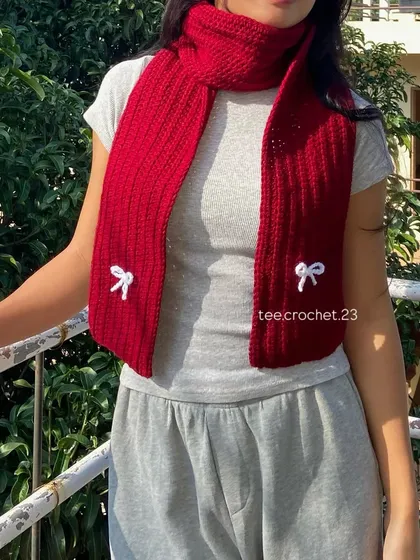 I love bringing custom ideas to life, like this anime-inspired Mikasa scarf. This piece shows the detailed ribbing and delicate bow accent, perfect for businesses looking for unique, themed apparel for their customers.