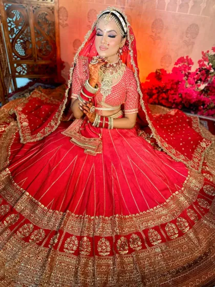 A wide shot capturing the grandeur of the bridal attire. The makeup is designed to be impactful both up close and from a distance, a crucial lesson in my bridal course.