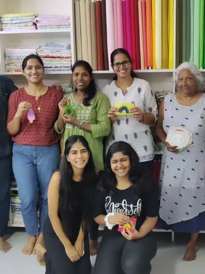 A group photo from another successful workshop, with participants of all ages proudly displaying their finished pieces.