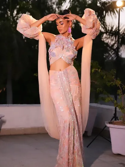A dramatic pose in a pastel peach fusion gown. I styled this with voluminous sleeves and intricate floral embroidery for a high-fashion, European-inspired look.