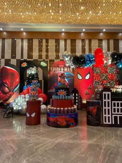 An overview of the entire Spider-Man party setup in a large hall, showing the scale and detail of the decorations.