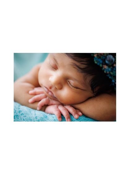 A duplicate of the macro shot, this close-up of a newborn's face emphasizes the delicate features that parents will want to remember forever.