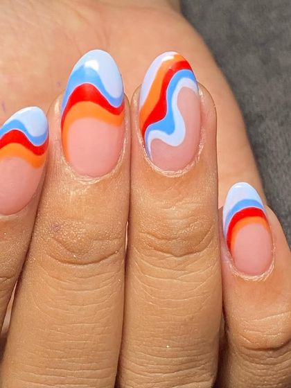 A groovy, retro-inspired swirl design with a fun color combination of orange, red, and blue.