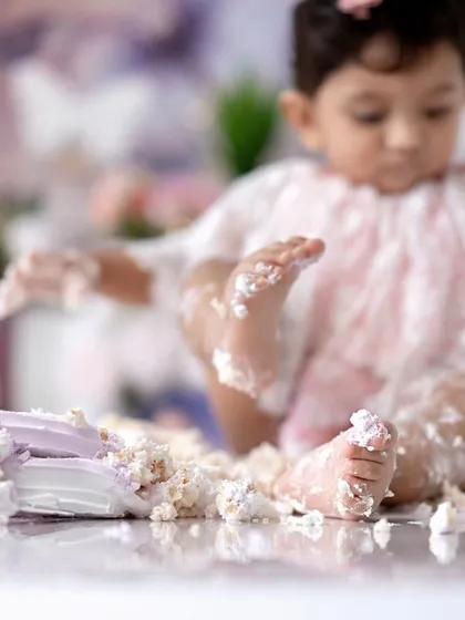 A different angle of the messy butterfly cake smash, focusing on the beautiful details of the setup.