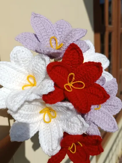 A close-up of some custom-colored lily stems from a blessed weekend order.
