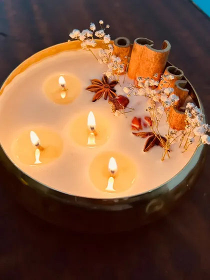 The beautiful glow of our large urli candle. It's perfect for setting a relaxing and luxurious mood during the festive season or any evening.