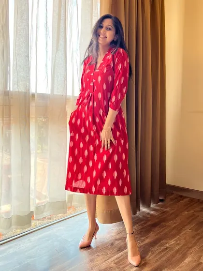 The summer breeze feels even better in this red Ikat dress-cum-kurta. It’s the perfect fusion of comfort and chic for sunny days.