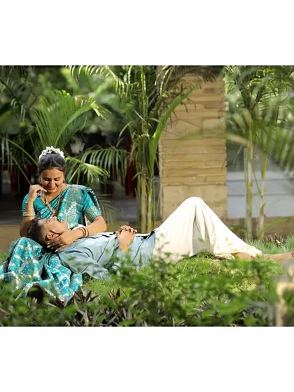 A relaxed and intimate moment captured in a lush garden. This style of candid photography feels very natural and truly captures the couple's bond.