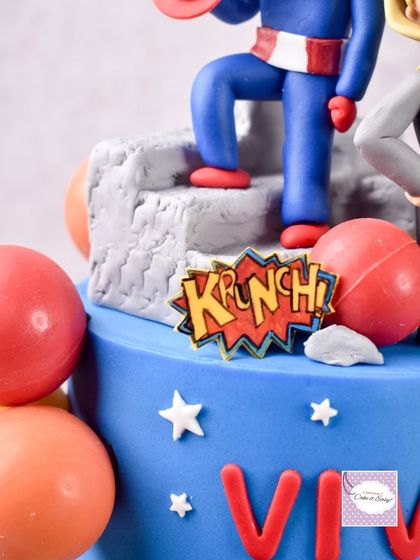 A detail from the Avengers cake, showing the "Krunch!" speech bubble and Captain America's legs.