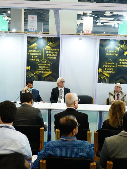 A wide view of a technical seminar, illustrating the professional setting we provide for knowledge exchange. We bring together experts from various fields, including electrical engineering and home automation, to discuss the future of the industry.