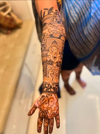 A side view of the extravagant design featuring Lord Ganesha, deer, and temple motifs. Each element is carefully placed to contribute to the overall narrative.