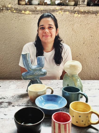After her beginner's course, this student rejoined for the advanced level. She created beautiful wheel-thrown mugs and bowls, and also explored sculptural hand-building, creating this unique candlestick holder.