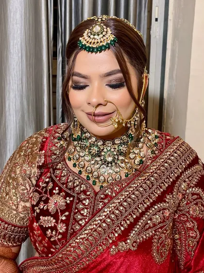A portrait of pure bridal elegance. The focus here is on the flawless, glowing base and the beautifully blended smokey eyeshadow, which adds depth without being overpowering.