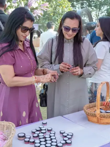 A DIY lip balm creation station at a carnival-themed event. I love incorporating these interactive stalls where guests can create their own personalized favors to take home.