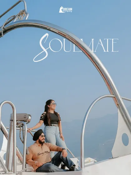 A beautifully framed shot using the boat's railing, with the word "Soulmate" elegantly written, creating a perfect portrait of togetherness.