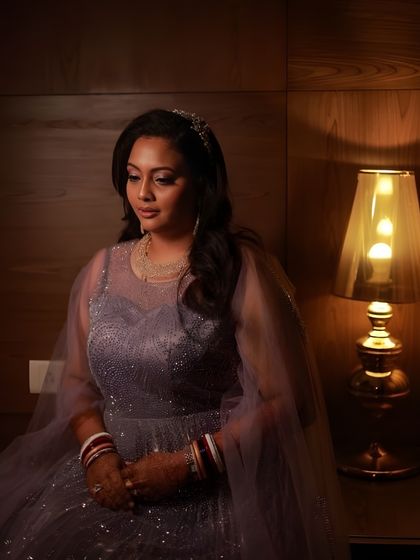 Another beautiful, softly lit portrait. The makeup is subtle yet effective, enhancing her natural beauty and giving her a serene, bridal glow.