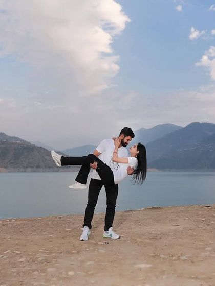 A classic romantic pose, with him lifting her up against the scenic backdrop of the lake. It’s a fun and timeless shot for any pre-wedding album.