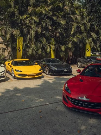 A vibrant collection of Ferraris, including the 296 GTB and Portofino, at the weekender event. My goal is to match the energy of these incredible machines with my music.